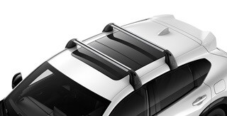 Se muestra la Acura ADX 2026 en Platinum White Pearl con el portaequipaje accesorio.