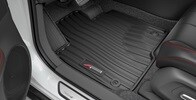 Interior de la Acura ADX 2026 con tapetes para todas las estaciones accesorios.
