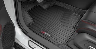 Interior de la Acura ADX 2026 con tapetes para todas las estaciones accesorios.