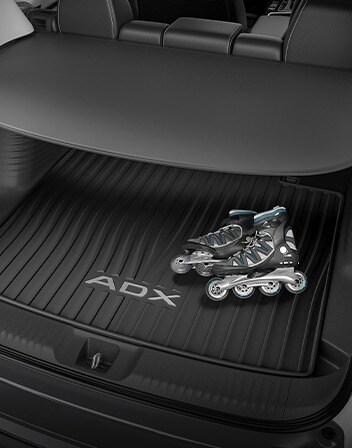 Interior de la Acura ADX 2026 con la cubierta de carga accesoria. Interior de la Acura ADX 2026 con la cubierta de carga accesoria.