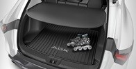 Interior de la Acura ADX 2026 con la cubierta de carga accesoria.