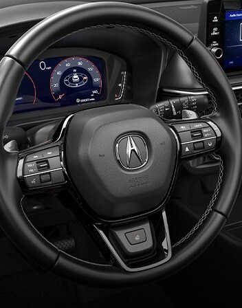 Interior de la Acura ADX 2026 con volante calefaccionado accesorio. Interior de la Acura ADX 2026 con volante calefaccionado accesorio.