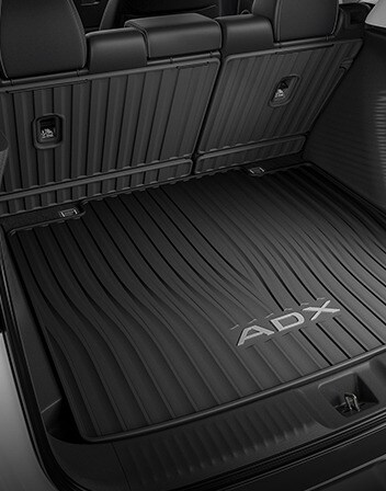 Interior de la Acura ADX 2026 con los protectores para los respaldos de los asientos accesorios. Interior de la Acura ADX 2026 con los protectores para los respaldos de los asientos accesorios.