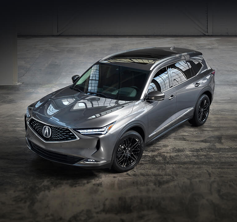 Acura MDX 2022 con Paquete Avanzado en Liquid Carbon Metallic en un depósito