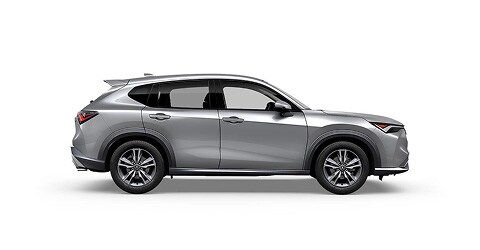 Se muestra la Acura ADX 2026 en Solar Silver Metallic, vista lateral (SUV compacta prémium).