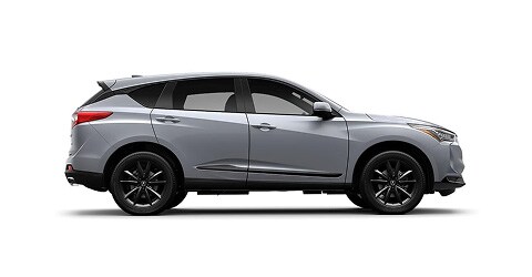Se muestra la Acura RDX 2026 en Solar Silver Metallic, vista lateral (SUV crossover deportiva prémium).