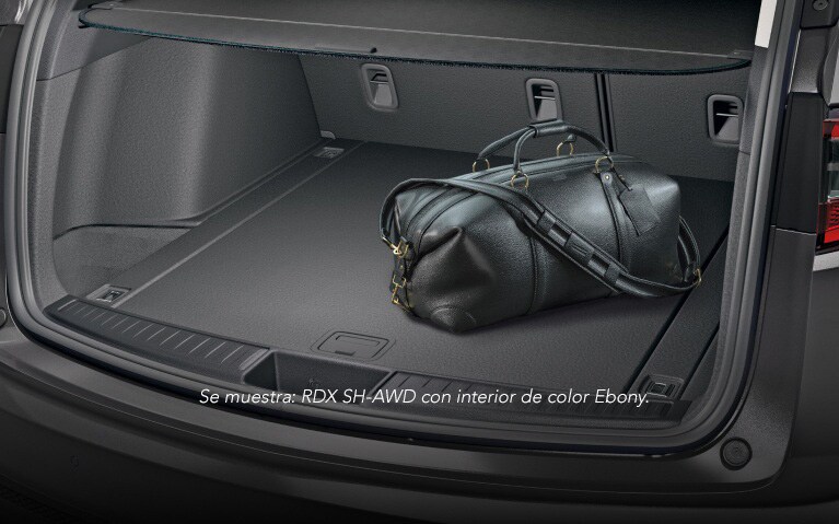 Acura RDX 2026 con Paquete Tecnológico e interior de color Parchment, que muestra el espacio de carga.